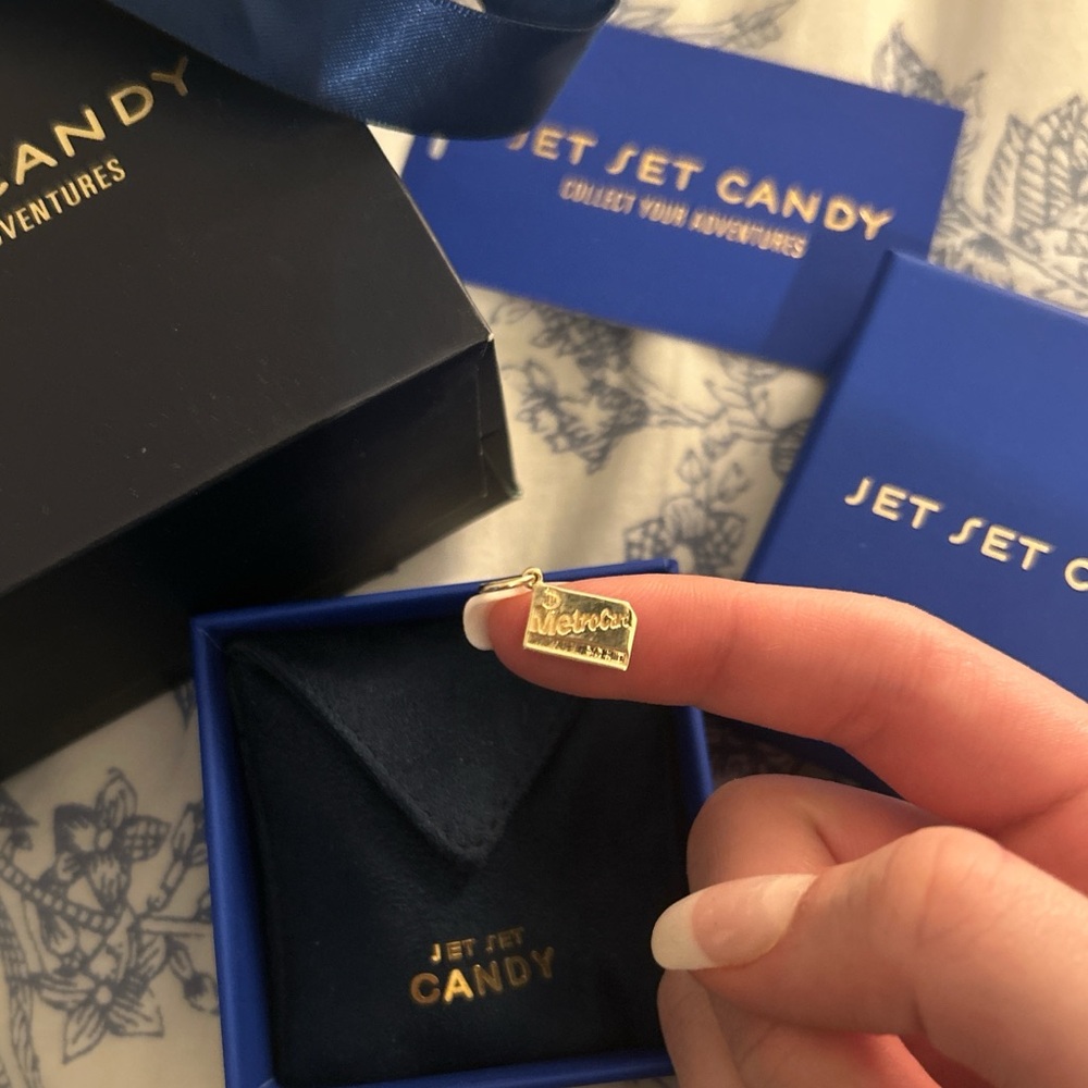 Jet set candy solid gold metro card charm